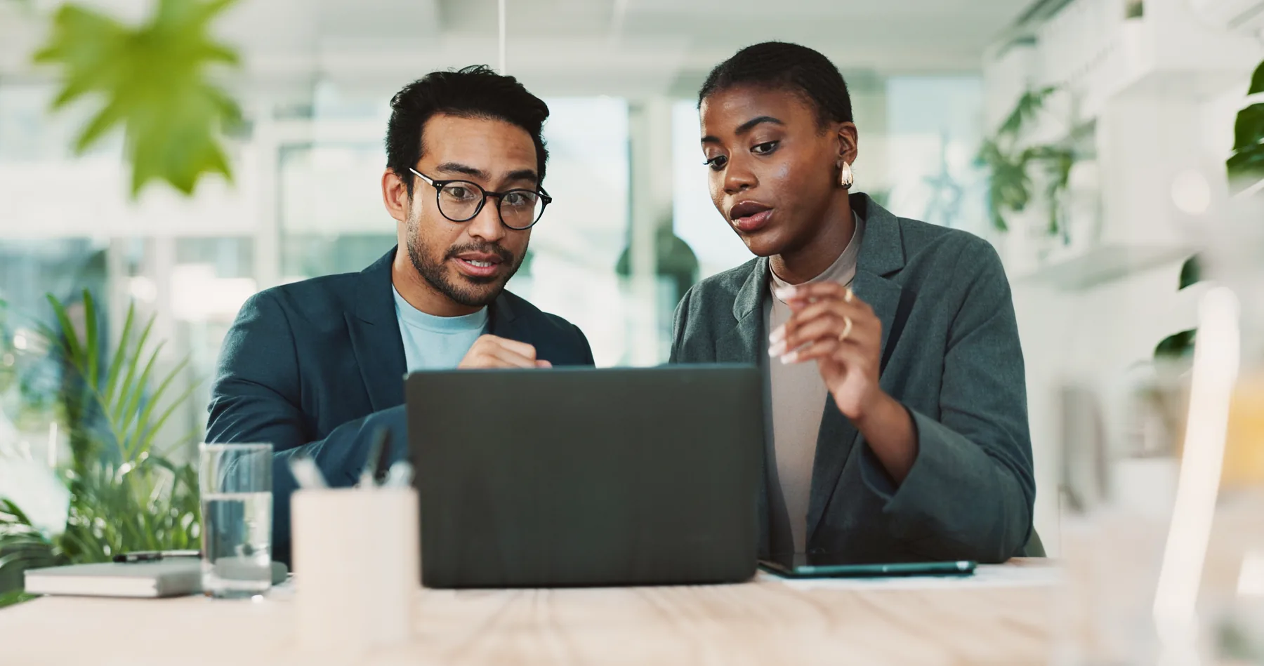 Consultants reviewing requirements for a training estimate